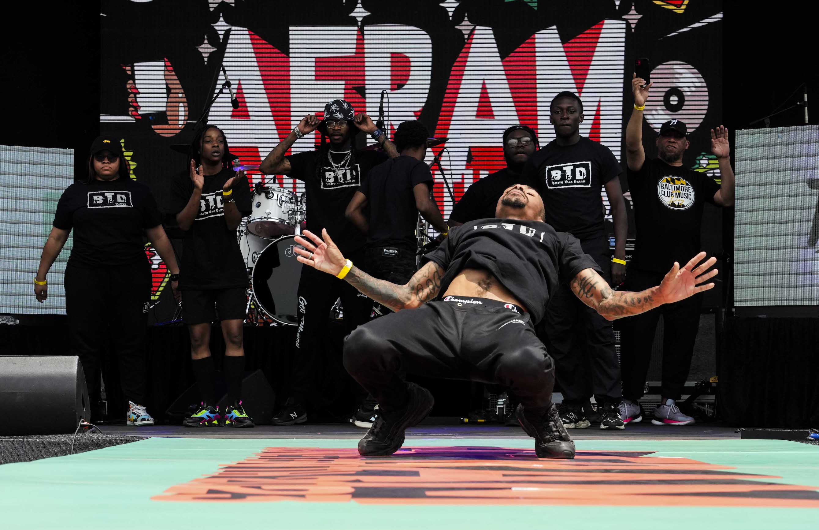 Bmore Than Dance dancer busting a complex move onstage.