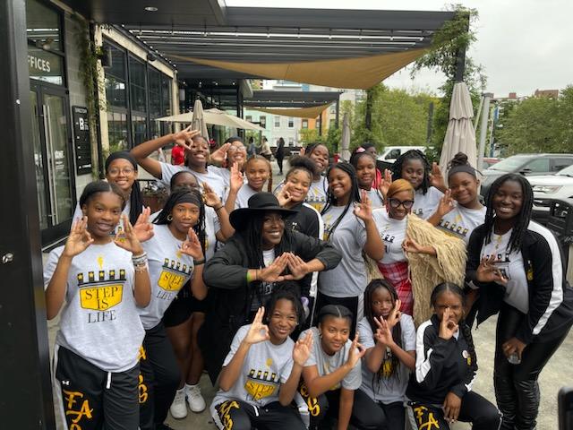 Fatal Attraction Step Squad posing with hand signals.